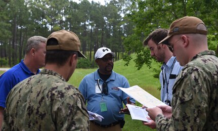 Inspectors and their military escorts working with the Defense Threat Reduction Agency and Naval Treaty Implementation Program prepare to inspect munitions bunkers during the International Chemical Weapons Convention exercise May 16, 2019, at Naval Weapons Station Charleston, Joint Base Charleston, S.C. The purpose of the exercise is to test the response of base assistance teams should the U.S. receive an international challenge inspection under the Chemical Weapons Convention Treaty. The Chemical Weapons Convention aims to eliminate an entire category of weapons of mass destruction by prohibiting the development, production, acquisition, stockpiling, retention, transfer or use of chemical weapons by State Parties. Exercises like these support the Department of Defense’s priority of reformation and full spectrum readiness in the face of new challenges. (U.S. Air Force photo by Senior Airman Cody R. Miller)