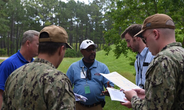 Inspectors and their military escorts working with the Defense Threat Reduction Agency and Naval Treaty Implementation Program prepare to inspect munitions bunkers during the International Chemical Weapons Convention exercise May 16, 2019, at Naval Weapons Station Charleston, Joint Base Charleston, S.C. The purpose of the exercise is to test the response of base assistance teams should the U.S. receive an international challenge inspection under the Chemical Weapons Convention Treaty. The Chemical Weapons Convention aims to eliminate an entire category of weapons of mass destruction by prohibiting the development, production, acquisition, stockpiling, retention, transfer or use of chemical weapons by State Parties. Exercises like these support the Department of Defense’s priority of reformation and full spectrum readiness in the face of new challenges. (U.S. Air Force photo by Senior Airman Cody R. Miller)