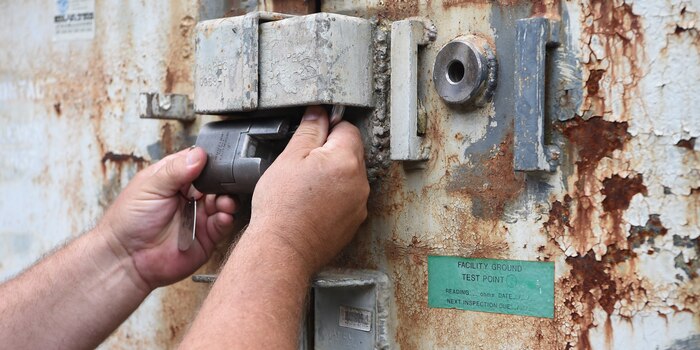 An inspector working for the Naval Treaty Implementation Program unlocks a munitions bunker during the International Chemical Weapons Convention exercise May 16, 2019, at Naval Weapons Station Charleston, Joint Base Charleston, S.C. The Naval Treaty Implementation Program provides comprehensive arms control treaty support to Navy and Marine Corps commanding officers, program managers, senior leadership and decision-makers. The purpose of the exercise is to test the response of base assistance teams should the U.S. receive an international challenge inspection under the Chemical Weapons Convention Treaty. The Chemical Weapons Convention aims to eliminate an entire category of weapons of mass destruction by prohibiting the development, production, acquisition, stockpiling, retention, transfer or use of chemical weapons by States Parties. Exercises like these support the Department of Defense’s priority of reformation and full spectrum readiness in the face of new challenges. (U.S. Air Force photo by Senior Airman Cody R. Miller)