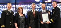 IMAGE: George Clotfelter receives the Navy Meritorious Civilian Service award during the annual honorary awards ceremony, May 10. Standing left to right: NSWCDD Dam Neck Activity Commanding Officer Cmdr. Andrew Hoffman; NSWCDD Deputy Technical Director Angela Beach; U.S. Rep. Rob Wittman; Clotfelter; and NSWCDD Commanding Officer Cmdr. Stephen ‘Casey’ Plew.