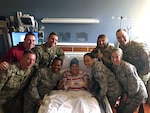 Master Sgt. Charlotte Ortiz, the assistant recruiting and retention superintendent for Headquarters, Ohio Air National Guard in Columbus, Ohio, exhibits her positive, joyful spirit during a visit with her co-workers, at Miami Valley Hospital in Dayton, Ohio. Ortiz is fighting a very rare type of cancer.