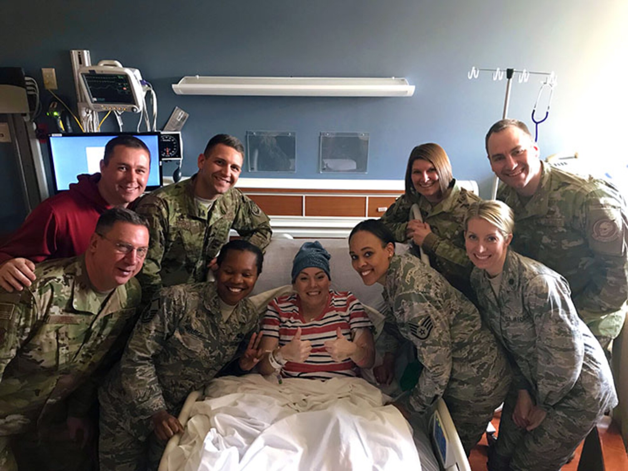Master Sgt. Charlotte Ortiz, the assistant recruiting and retention superintendent for Headquarters, Ohio Air National Guard in Columbus, Ohio, exhibits her positive, joyful spirit during a visit with her co-workers, at Miami Valley Hospital in Dayton, Ohio. Ortiz is fighting a very rare type of cancer.