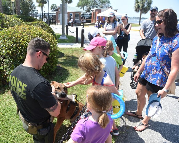 The Charleston Police Department holds a “meet-and-greet” for families to interact with law enforcement working dogs and their handlers, who are often employed in both drug and explosive detection operations, during National Safe Boating Week May 18, 2019, at U.S. Coast Guard Sector Charleston in Charleston, S.C. The U.S. Coast Guard often coordinates with local authorities to augment their mission of maritime law enforcement. The Coast Guard National Safe Boating Week Campaign is an annual week-long event held every May to promote boating safety and to inform the public on proper boating procedures. Federal law mandates that the U.S. Coast Guard establish the National Boating Safety Advisory Council and consult with it on regulations and other major boating safety matters. (U.S. Air Force photo by Senior Airman Cody R. Miller)