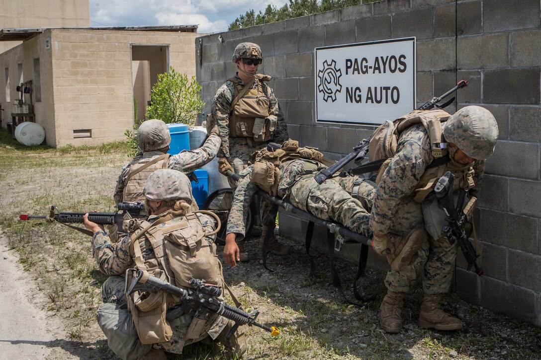U.S. Marines with Combat Logistics Battalion 8, Combat Logistics Regiment 2, 2nd Marine Logistics Group, evacuate a casualty during a training exercise at Camp Lejeune, North Carolina, May 16, 2019. CLB 8 held the exercise to train Marines in core mission tasks and provide company-level convoy operations training. (U.S. Marine Corps photo by Cpl. Damion Hatch)