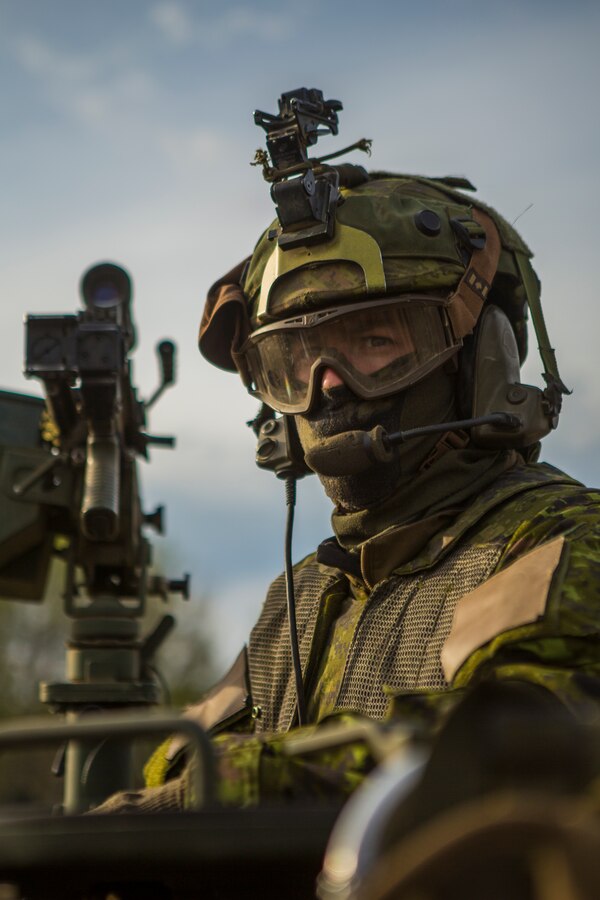 Canadian Army Capt. Dave Crosbie, a light armored vehicle (LAV) captain with Charlie Company, 1st Battalion Princess Patricia’s Canadian Light Infantry, looks behind his LAV during a movement in exercise Maple Resolve in Camp Wainwright, Alberta, Canada, May 12, 2019. Maple Resolve is an annual exercise, 3-week multinational simulated war, hosted by the Canadian Army bringing NATO allies together from across the world to share and learn tactics while strengthening foreign military ties. (U.S. Marine Corps photo by Cpl. Niles Lee)