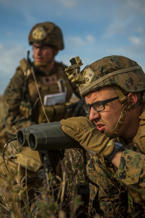 U.S. Sailor and Marines from 6th Air Naval Gunfire Liaison Company, Force Headquarter Group, Marine Forces Reserve, provide overwatch for Canadian forces moving into a town during stability operations in exercise Maple Resolve in Camp Wainwright, Alberta, Canada, May 13, 2019. Maple Resolve is an annual exercise, 3-week multinational simulated war, hosted by the Canadian Army bringing NATO allies together from across the world to share and learn tactics while strengthening foreign military ties. (U.S. Marine Corps photo by Cpl. Niles Lee)