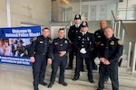 For National Police Week, DIA sent members of the police force to Ronald Reagan Washington National Airport to assist with the arrival of survivors and families of police officers from across the globe, including those from England. Photographed (from left to right) is DIA Police Officers Frankie Hill, Eric Plamp, Deondrey Ellis and Cory Jones.
