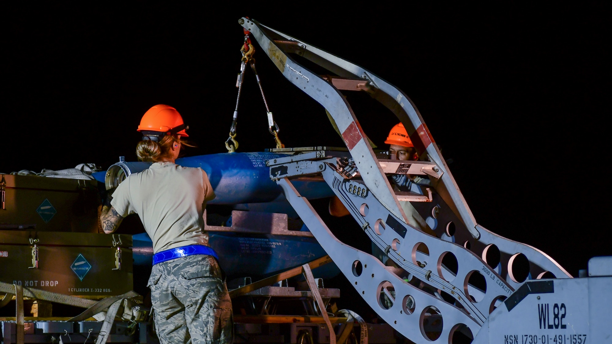 U.S. Air Force Airmen from the 355th Equipment Maintenance Squadron work together to build an [inert] GBU-12 Paveway II, an aerial laser-guided bomb, in a simulated deployed location on the flight line at Davis-Monthan Air Force Base, Ariz., April 9, 2019.