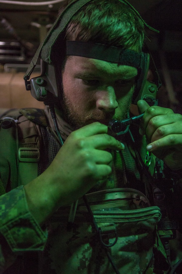 Canadian Army Lt. Ken Wismer, a platoon commander with Charlie Company, 1st Battalion  Princess Patricia’s Canadian Light Infantry, adjusts his headset during exercise Maple Resolve in Camp Wainwright, Alberta, Canada, May 13, 2019. Maple Resolve is an annual exercise, 3-week multinational simulated war, hosted by the Canadian Army bringing NATO allies together from across the world to share and learn tactics while strengthening foreign military ties. (U.S. Marine Corps photo by Cpl. Niles Lee)