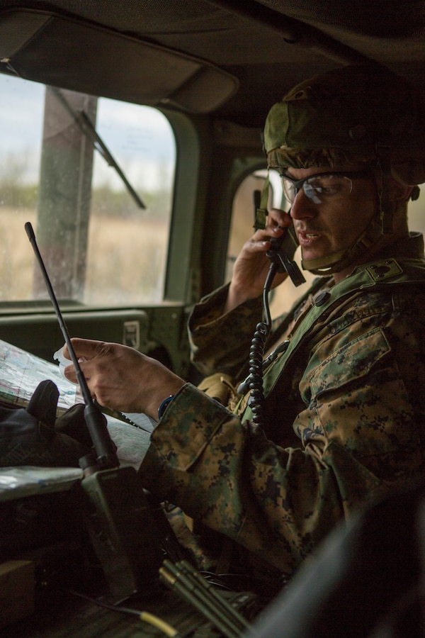 U.S Navy Lt. Carter Bonnafoux, a naval gunfire liaison officer with 6th Air Naval Gunfire Liaison Company, Force Headquarter Group, Marine Forces Reserve, radios his grid during exercise Maple Resolve in Camp Wainwright, Alberta, Canada, May 14, 2019. Maple Resolve is an annual exercise, 3-week multinational simulated war, hosted by the Canadian Army bringing NATO allies together from across the world to share and learn tactics while strengthening foreign military ties. (U.S. Marine Corps photo by Cpl. Niles Lee)