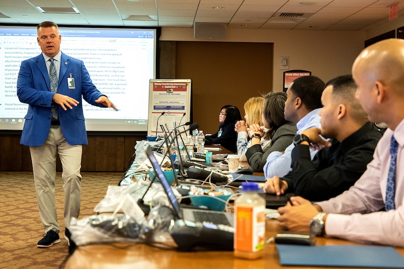 Tony Taylor, U.S. Army Financial Management Command EagleCash program manager, trains students on lessons learned during the last decade of deployed operations during a USAFMCOM and Federal Reserve Bank of Boston-hosted training session at the Federal Reserve Bank of Boston May 8, 2019.