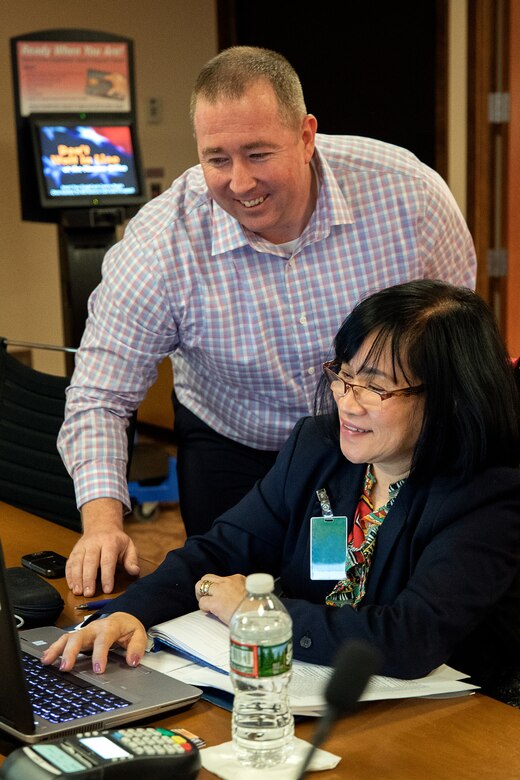 U.S. Army Sgt. 1st Class Shawn Crocker, U.S. Army Financial Management Command operational support trainer, provides EagleCash guidance to Ma Rivera, U.S. Military Training Mission to Saudi Arabia cashier, during a USAFMCOM and Federal Reserve Bank of Boston-hosted training session at the Federal Reserve Bank of Boston May 8, 2019.