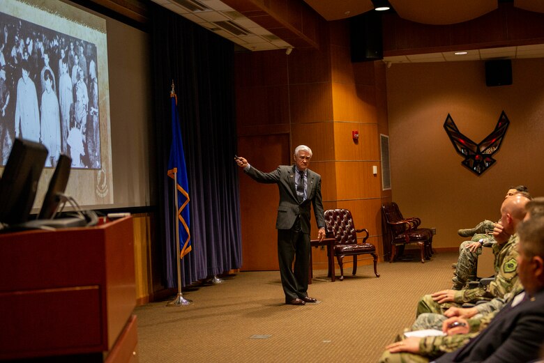 Vietnam Prisoner of War, retired Air Force Lt. Col. Barry Bridger presents slide of the Hanoi March of Vietnam POWs at commander’s update briefing May 16, 2019, at Offutt Air Force Base, Nebraska. The camp was infamous for the unsanitary conditions, starvation and the severe torture methods they imposed on POWs.