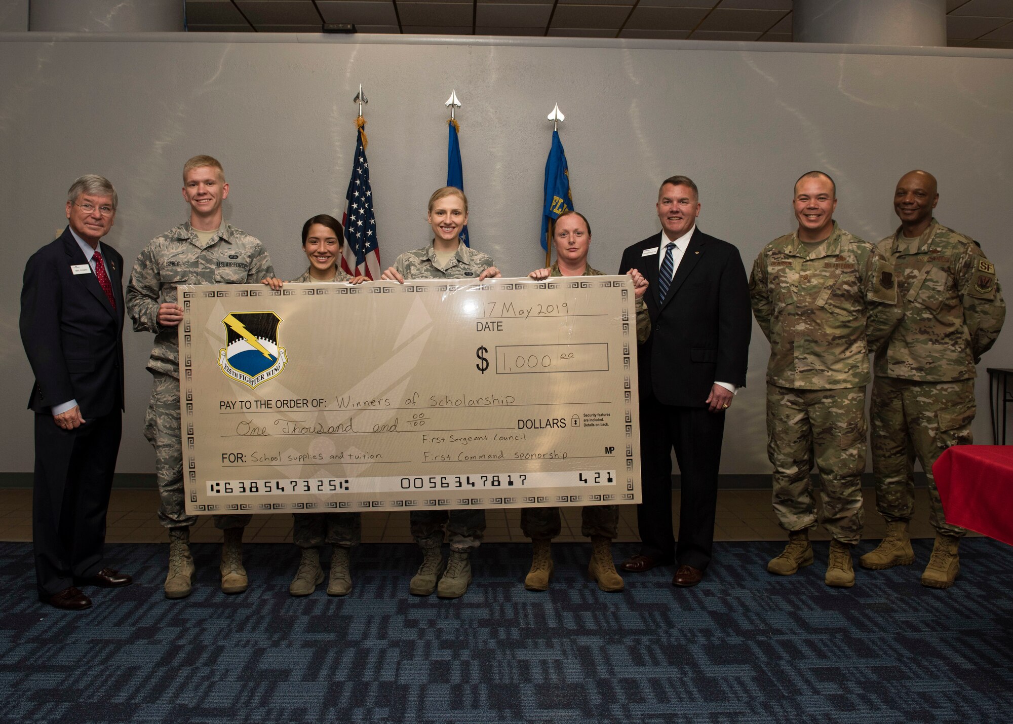Four U.S. Air Force Airmen from Tyndall Air Force Base, Florida, are awarded $1,000 scholarships, May 17, 2019 at Tyndall AFB.