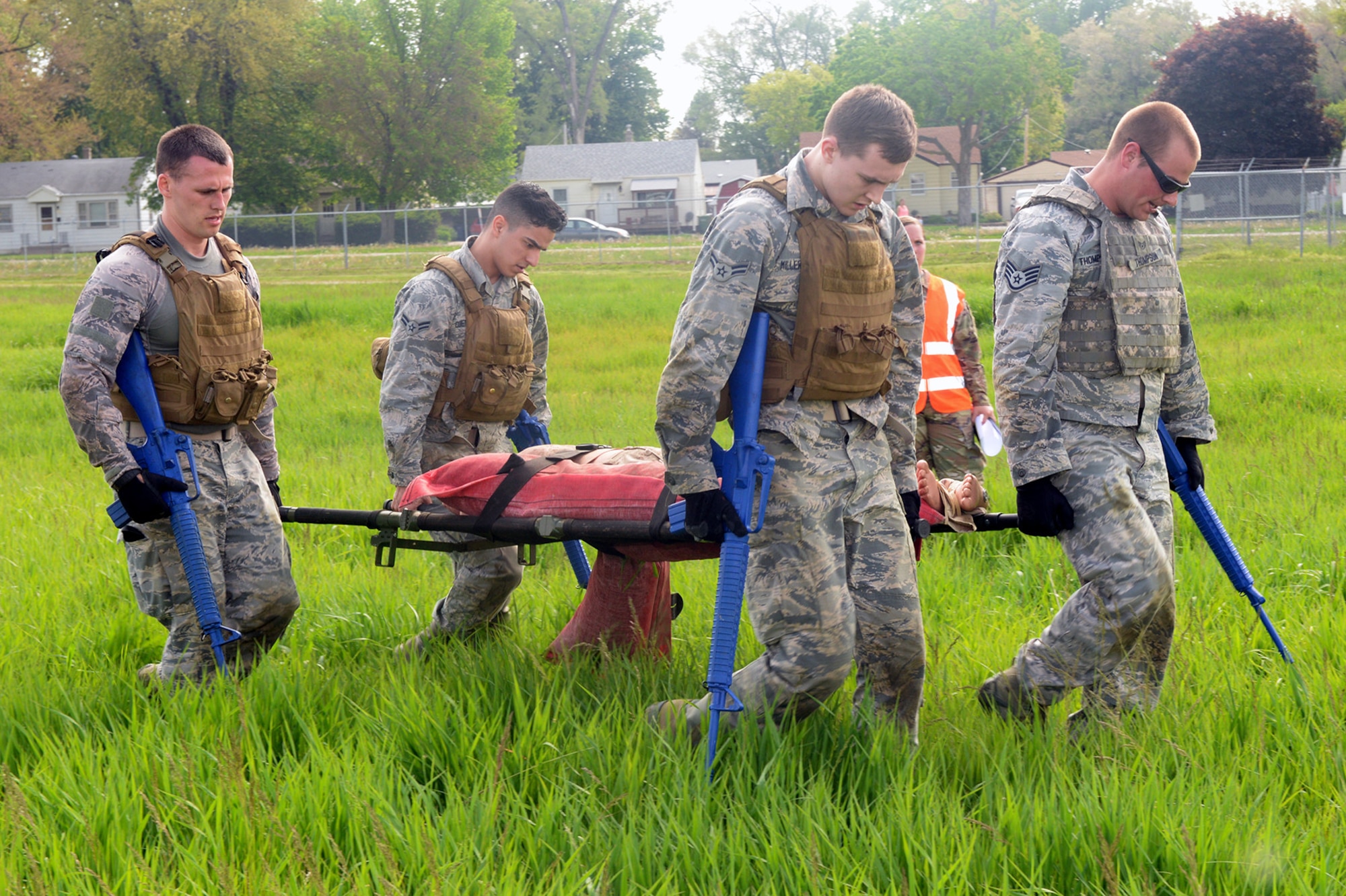 Participants of the Raider Challenge perform a casualty evacuation carrying fifty pounds of sandbags through an obstacle course May 15, 2019, at Offutt Air Force Base, Nebraska. In 1962, President John F. Kennedy signed a proclamation which designated May 15 as Peace Officers Memorial Day and the week in which that date falls as Police Week. (U.S. Air Force photo by Kendra Williams)