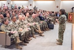 U.S. Navy Vice Adm. Raquel Bono, Defense Health Agency director, discusses the DHA transition during a town hall meeting at Brooke Army Medical Center May 14. BAMC will transition under DHA command and authority Oct. 1.