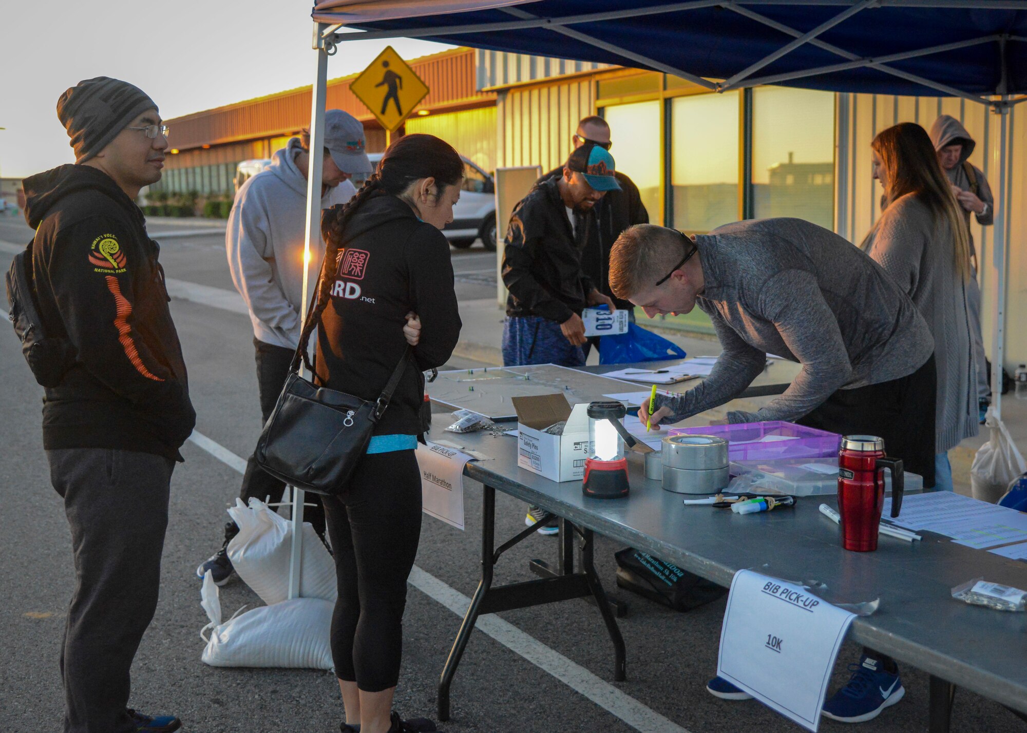 Competitors check in during the Run with History Half Marathon, 10k and 5k at Edwards Air Force Base, Calif., May 18. (U.S. Air Force photo by Giancarlo Casem)