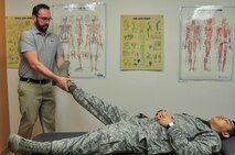 Dr. Jason Wheeler, 359th Medical Operations Squadron Physical Therapy Flight physical therapist, performs hip manipulation on Airman 1st Class Albert Lapera, 359th Medical Group physical therapy technician, to demonstrate one type of physical therapy used to help patients with arthritis. Arthritis Awareness Month, which is observed in May, is a time to motivate people, especially those with arthritis, to become more physically active.