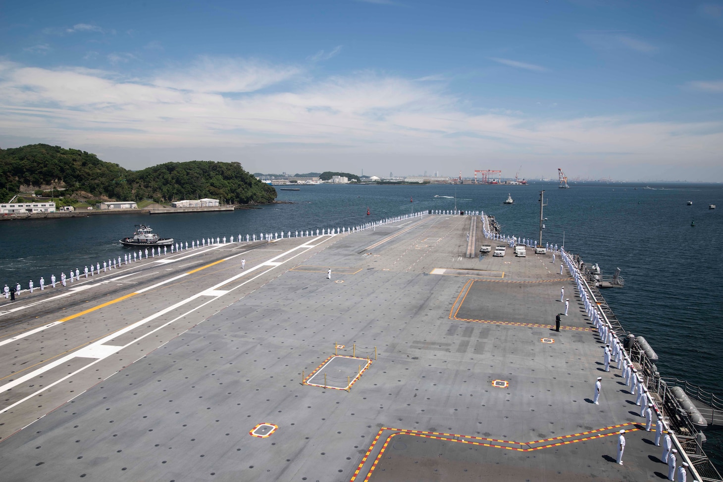 YOKOSUKA, Japan (May 22, 2019) Sailors man the rails on the flight deck of the Navy’s forward-deployed aircraft carrier, USS Ronald Reagan (CVN 76), departs Commander, Fleet Activities Yokosuka for a scheduled patrol. Ronald Reagan provides a combat-ready force, which protects and defends the collective maritime interests of the U.S. and its allies and partners in the Indo-Pacific region.