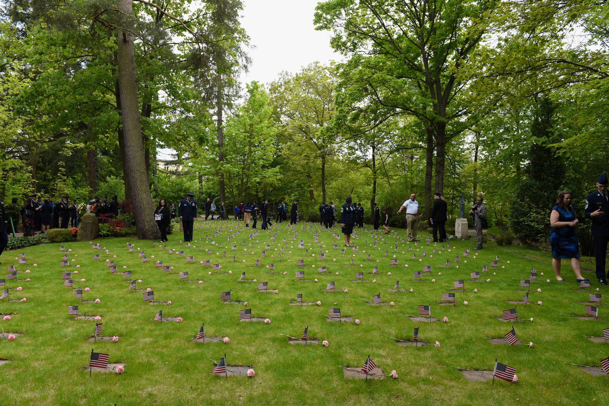 Attendees of the Kindergraves memorial service pay their respects at the Kaiserslautern Main Cemetery, Kaiserslautern, Germany, May 19, 2019. With a few exceptions, these little ones were the children of American military members stationed in the Kaiserslautern community. (U.S. Air Force photo by Airman 1st Class Kaylea Berry)