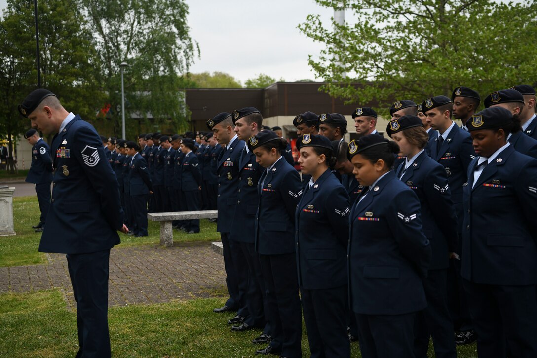 Members of the 100th and 48th Security Forces Squadrons have a moment of silence for the fallen police men and women during National Police Week at RAF Lakenheath, England, May 17, 2019. National Police Week was first established in 1962 under the direction of former President John F. Kennedy. Kennedy designated May 15 as Peace Officers Memorial Day and the week in which that date falls is known as “Police Week.” (U.S. Air Force photo by Senior Airman Alexandria Lee)