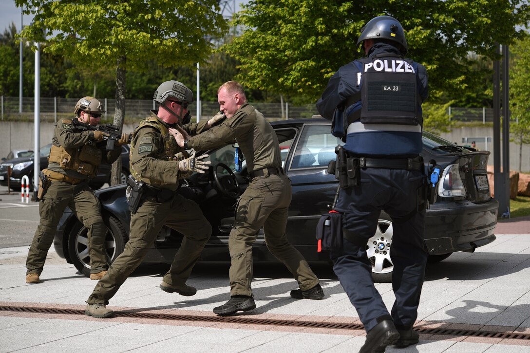 Kaiserslautern Military Community law enforcement officers perform a detaining demostration during Police Week 2019 on Ramstein Air Base, Germany, May 16, 2019.