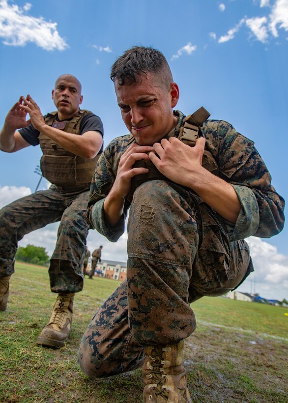 U.S. Marine Corps Sgt. Neil Biangel, right, an aviation ordnance systems technician with Marine Aircraft Group 49, 4th Marine Aircraft Wing, Marine Forces Reserve, participates in a combat conditioning exercise at Naval Air Station Joint Reserve Base New Orleans on May 20, 2019. To increase readiness and to support the total force, Reserve and active Marines with MARFORRES participate in the Martial Arts Instructor Course.  (U.S. Marine Corps photo by Lance Cpl. Jose Gonzalez)