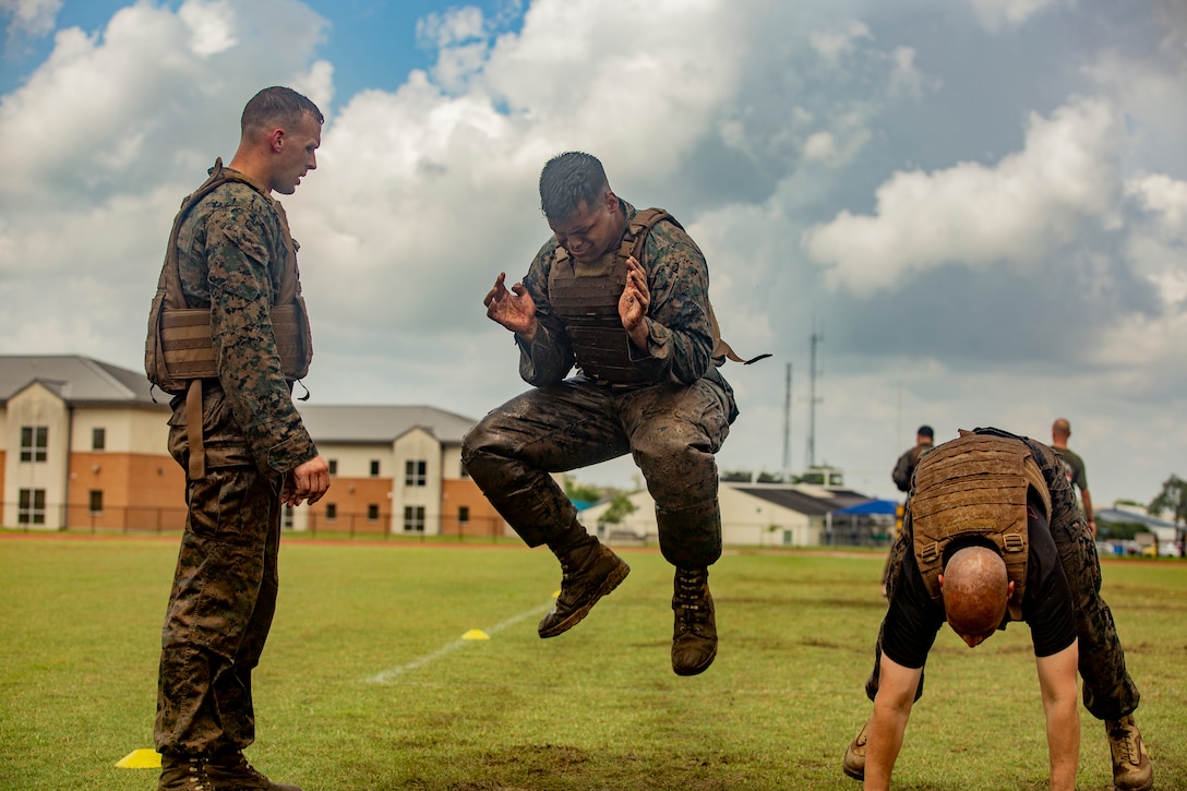 U.S. Marines with Martial Arts Instructor Course 1-19 participate in a combat conditioning exercise at Naval Air Station Joint Reserve Base New Orleans on May 20, 2019. To increase readiness and to support the total force, Reserve and active Marines with Marine Forces Reserve participate in the Martial Arts Instructor Course.  (U.S. Marine Corps photo by Lance Cpl. Jose Gonzalez)