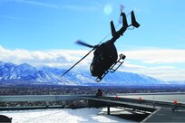 A UH-72 Lakota takes off from the helipads of the Wells Fargo building in Salt Lake City