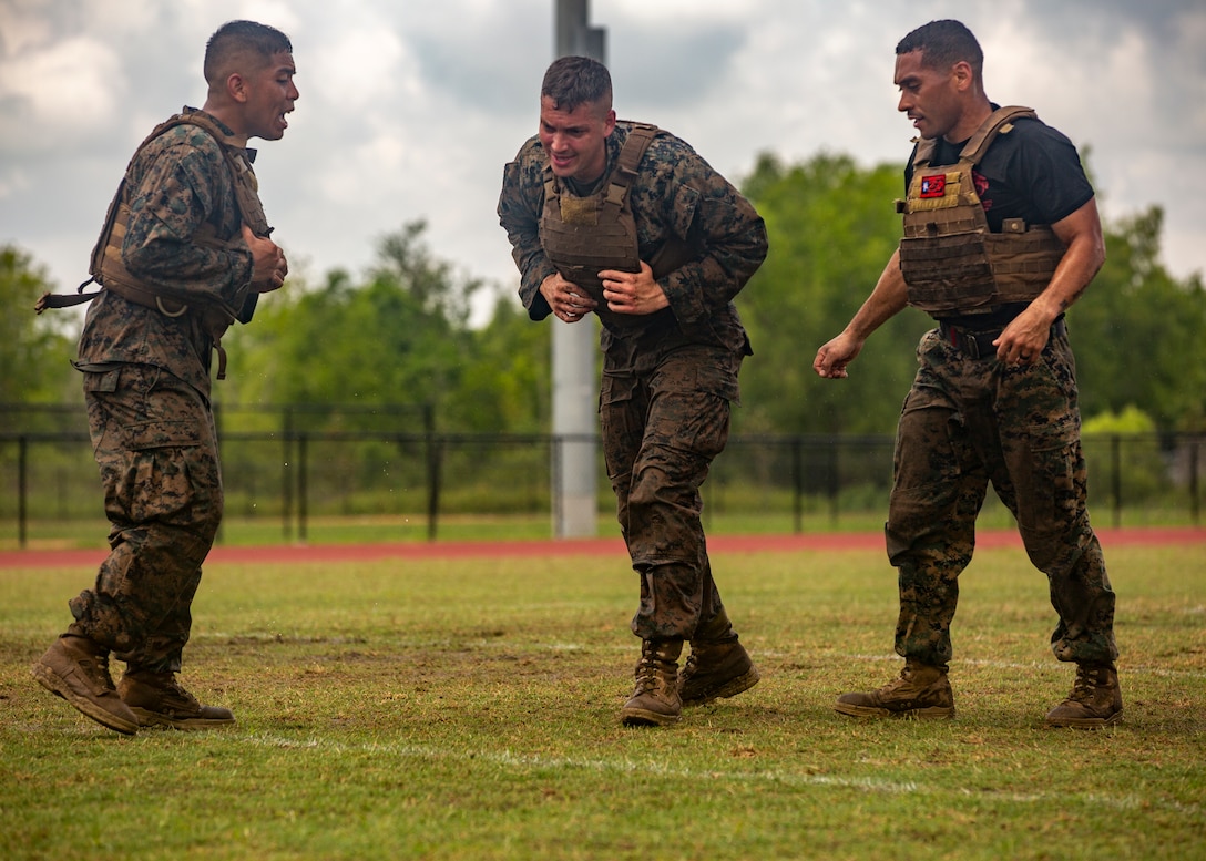 U.S. Marines with Martial Arts Instructor Course 1-19 participate in a combat conditioning exercise at Naval Air Station Joint Reserve Base New Orleans on May 20, 2019. To increase readiness and to support the total force, Reserve and active Marines with Marine Forces Reserve participate in the Martial Arts Instructor Course.  (U.S. Marine Corps photo by Lance Cpl. Jose Gonzalez)