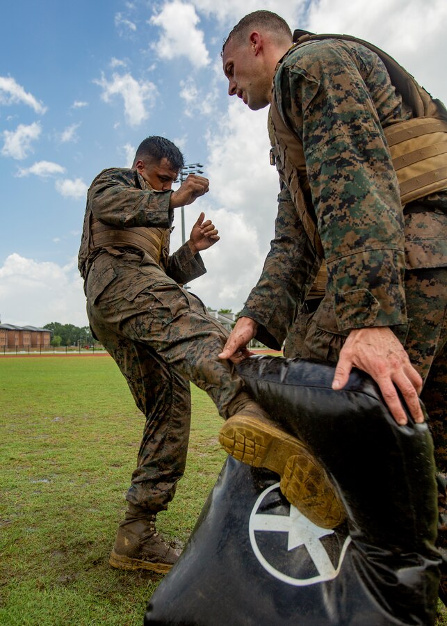 U.S. Marine Corps Cpl. Julio Vasquezch, left, an aviation technician with Marine Aircraft Group 49, 4th Marine Aircraft Wing, Marine Forces Reserve, participates in a combat conditioning exercise at Naval Air Station Joint Reserve Base New Orleans on May 20, 2019. To increase readiness and to support the total force, Reserve and active Marines with MARFORRES participate in the Martial Arts Instructor Course.  (U.S. Marine Corps photo by Lance Cpl. Jose Gonzalez)
