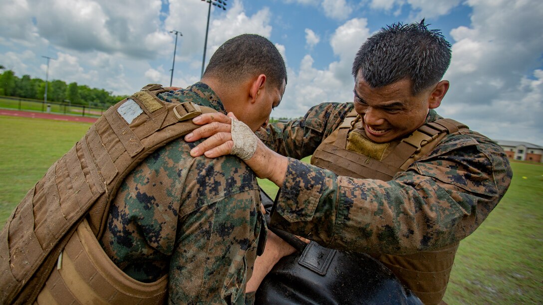 U.S. Marine Corps Staff Sgt. Chanratha Lim, right, a dynamic component mechanic with Marine Aircraft Group 49, 4th Marine Aircraft Wing, Marine Forces Reserve, participates in a combat conditioning exercise at Naval Air Station Joint Reserve Base New Orleans on May 20, 2019. To increase readiness and to support the total force, Reserve and active Marines with MARFORRES participate in the Martial Arts Instructor Course.  (U.S. Marine Corps photo by Lance Cpl. Jose Gonzalez)