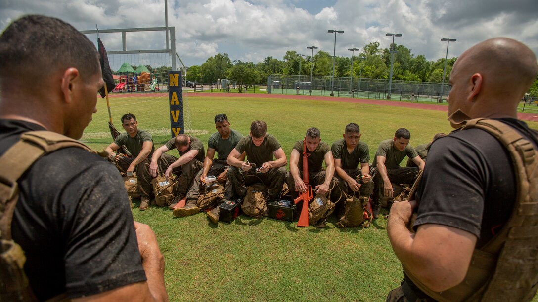 U.S. Marines with Martial Arts Instructor Course 1-19 receive a brief after a combat conditioning exercise at Naval Air Station Joint Reserve Base New Orleans on May 20, 2019. To increase readiness and to support the total force, Reserve and active Marines with Marine Forces Reserve participate in the Martial Arts Instructor Course.  (U.S. Marine Corps photo by Lance Cpl. Jose Gonzalez)