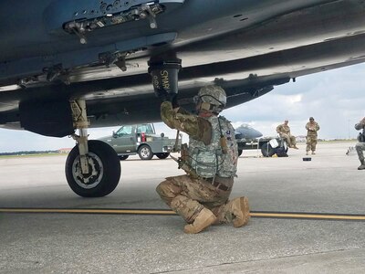 Tech. Sgt. Steven Wilson, 4th Logistics Readiness Squadron air transportation craftsman, performs hot-pit refueling of an F-15E during the Combat Support Wing capstone, May 9, 2019, at MacDill Air Force Base, Florida. The CSW provides multifunctional training for Airmen to rapidly deploy in smaller, more efficient and agile teams, effectively creating a smaller footprint in dangerous or non-permissive areas.