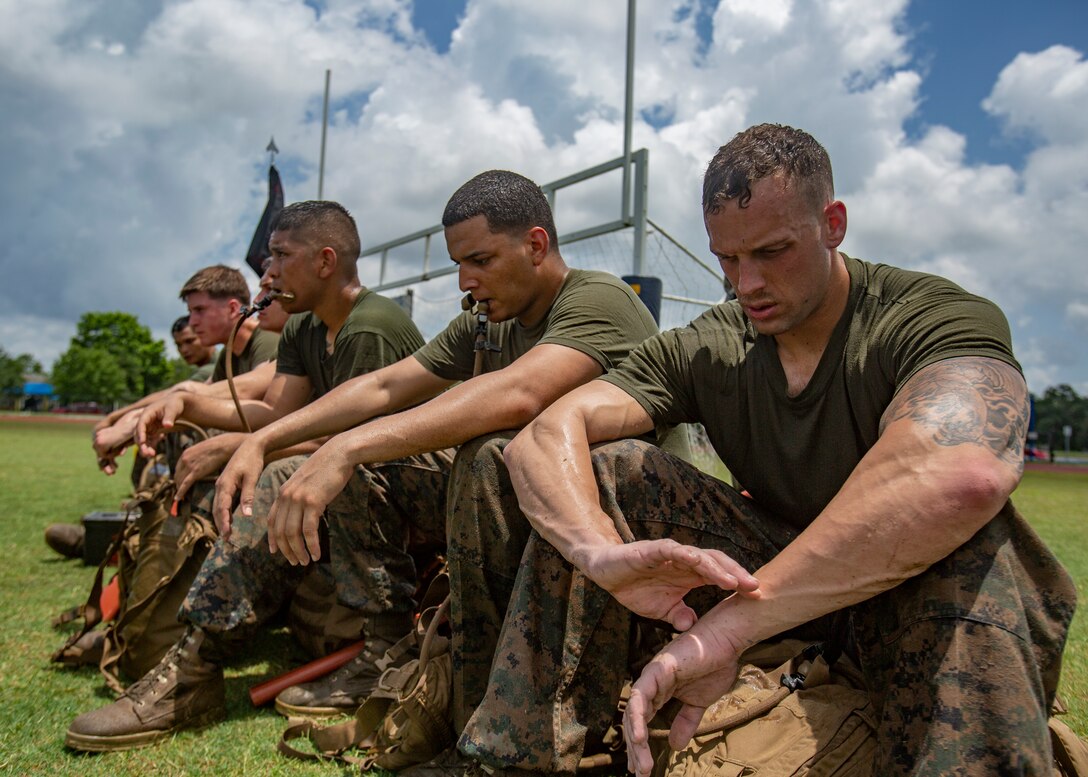 U.S. Marines with Martial Arts Instructor Course 1-19 receive a brief after a combat conditioning exercise at Naval Air Station Joint Reserve Base New Orleans on May 20, 2019. To increase readiness and to support the total force, Reserve and active Marines with Marine Forces Reserve participate in the Martial Arts Instructor Course.  (U.S. Marine Corps photo by Lance Cpl. Jose Gonzalez)