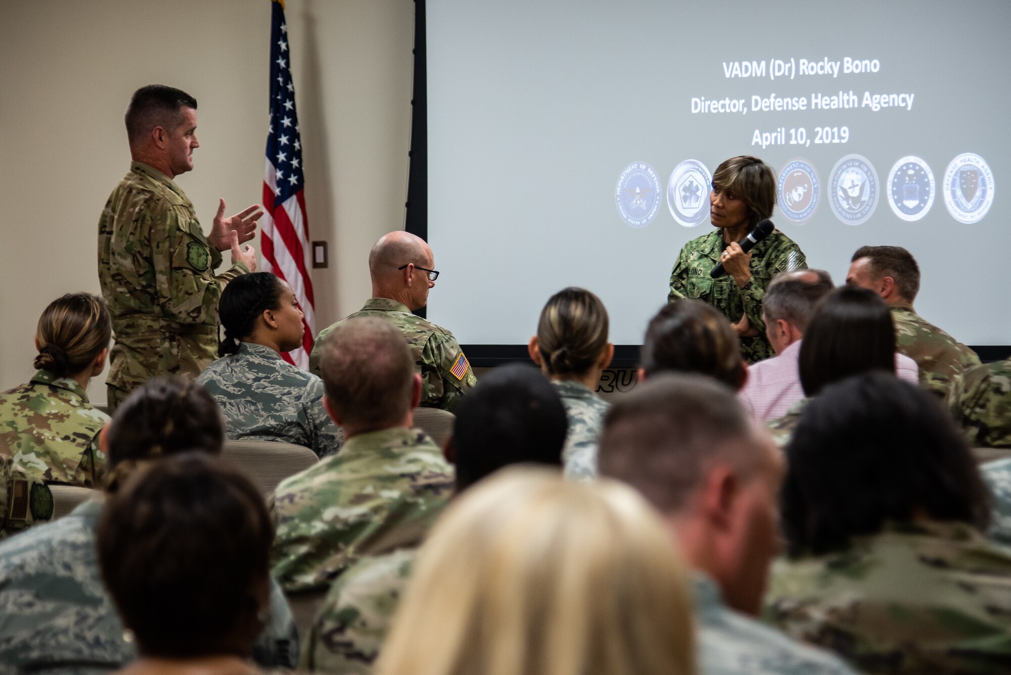 A U.S. Air Force Airman asks Vice Adm. Raquel Bono, Defense Health Agency director, a question during a town hall at Shaw Air Force Base, S.C., May 1, 2019.