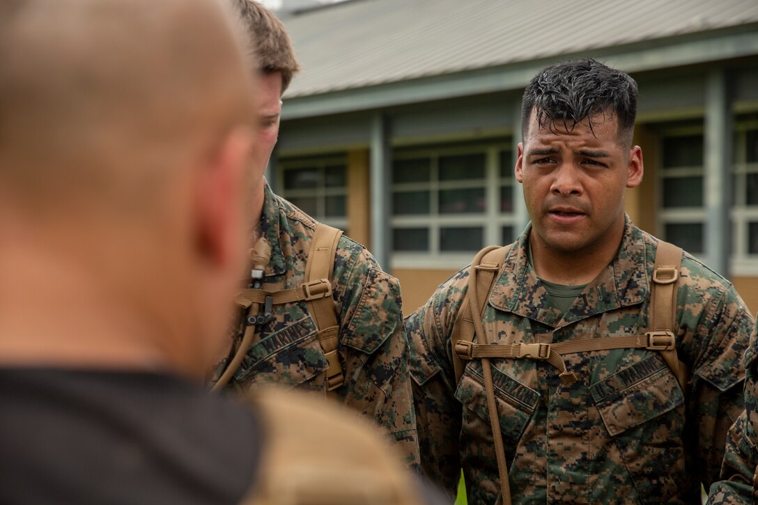 U.S. Marine Corps Cpl. Julio Vasquezch, an aviation technician with Marine Aircraft Group 49, 4th Marine Aircraft Wing, Marine Forces Reserve, receives a brief after a combat conditioning exercise at Naval Air Station Joint Reserve Base New Orleans on May 20, 2019. To increase readiness and to support the total force, Reserve and active Marines with MARFORRES participate in the Martial Arts Instructor Course.  (U.S. Marine Corps photo by Lance Cpl. Jose Gonzalez)