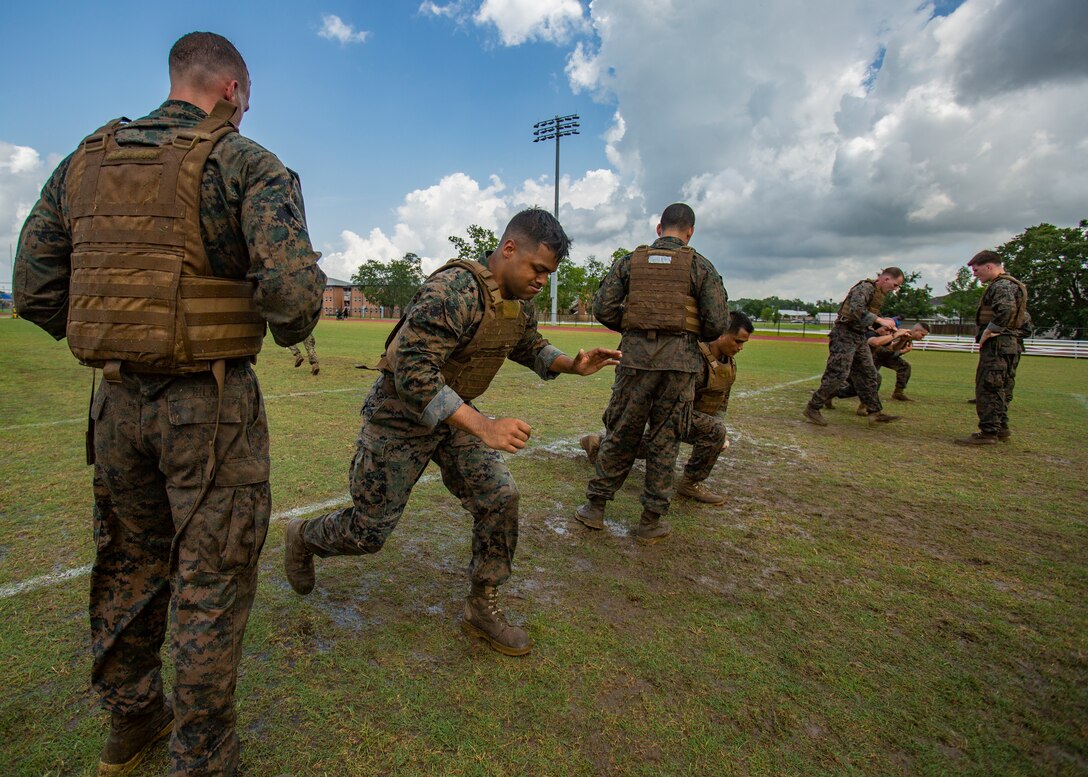 U.S. Marines with Martial Arts Instructor Course 1-19 participate in a combat conditioning exercise at Naval Air Station Joint Reserve Base New Orleans on May 20, 2019. To increase readiness and to support the total force, Reserve and active Marines with Marine Forces Reserve participate in the Martial Arts Instructor Course.  (U.S. Marine Corps photo by Lance Cpl. Jose Gonzalez)