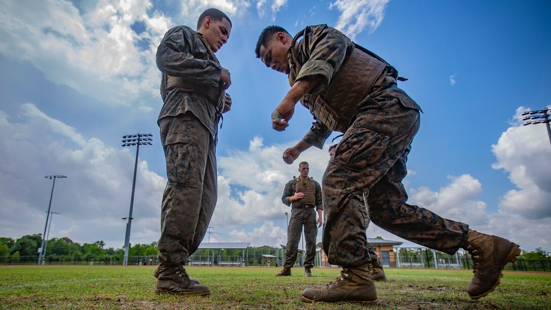 U.S. Marine Corps Staff Sgt. Chanratha Lim, right, a dynamic component mechanic with Marine Aircraft Group 49, 4th Marine Aircraft Wing, Marine Forces Reserve, participates in a combat conditioning exercise at Naval Air Station Joint Reserve Base New Orleans on May 20, 2019. To increase readiness and to support the total force, Reserve and active Marines with MARFORRES participate in the Martial Arts Instructor Course.  (U.S. Marine Corps photo by Lance Cpl. Jose Gonzalez)