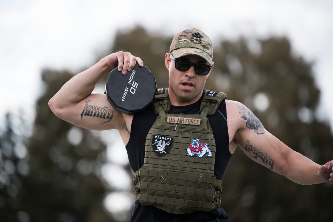 Tech. Sgt. Paul Olmos, 30th Security Forces Squadron military working dog section NCO in charge, performs box steps during the Police Week Warrior Workout of the Day Challenge May 16, 2019, at Vandenberg Air Force Base, Calif. In 1962, President John F. Kennedy signed a proclamation that designated May 15 as Peace Officers Memorial Day and the week in which that date falls as Police Week. (U.S. Air Force photo by Airman 1st Class Hanah Abercrombie)