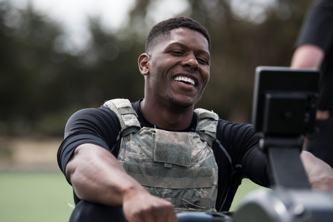 1st Lt. Xavier Jones, 17th Training Squadron test team project manager, performs the row workout during the Police Week Warrior Workout of the Day Challenge May 16, 2019, at Vandenberg Air Force Base, Calif. Each competing team of two sprinted between eight workout stations, comprised of various style gym equipment and functional movements while wearing a level-4 plate carrier and had 17 minutes to complete the course. (U.S. Air Force photo by Airman 1st Class Hanah Abercrombie)
