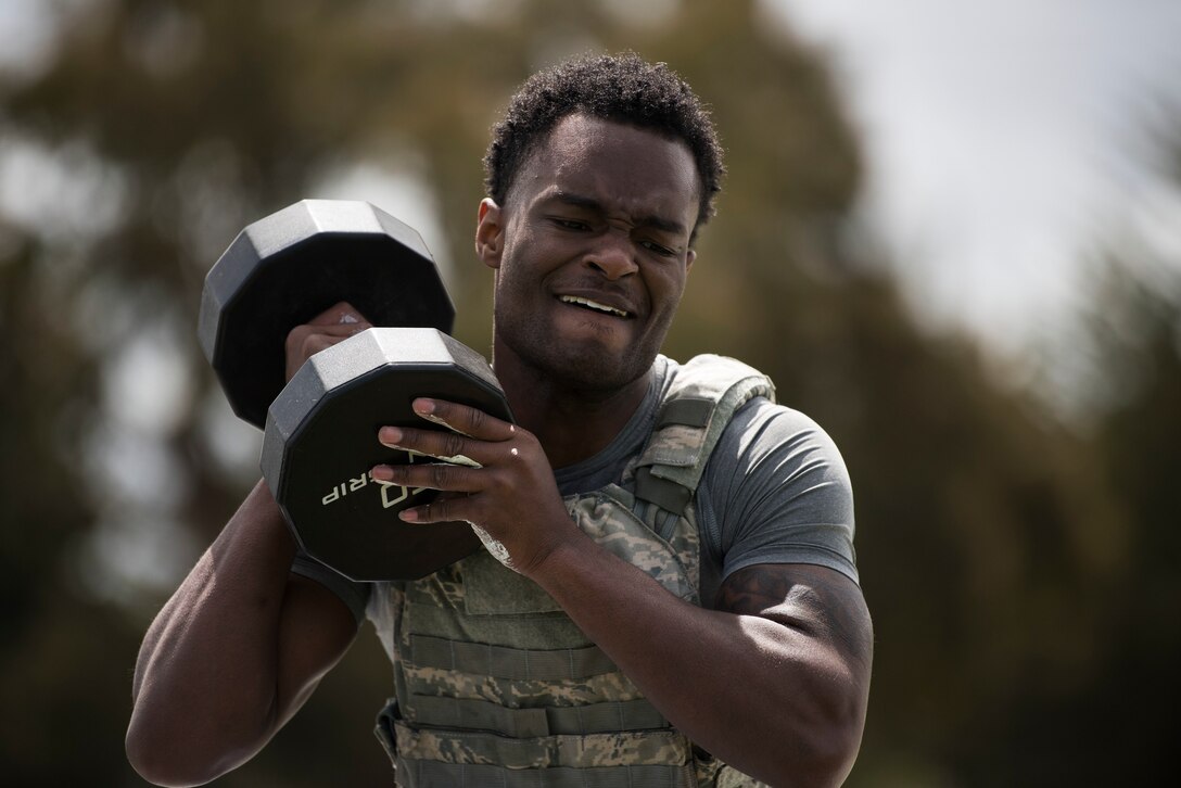 Airman 1st Class Shomari Gervin, 30th Security Forces Squadron defender, performs box step-ups while carrying a 50 pound weight during the Police Week Warrior Workout of the Day Challenge May 16, 2019, at Vandenberg Air Force Base, Calif. In 1962, President John F. Kennedy signed a proclamation that designated May 15 as Peace Officers Memorial Day and the week in which that date falls as Police Week. (U.S. Air Force photo by Airman 1st Class Hanah Abercrombie)