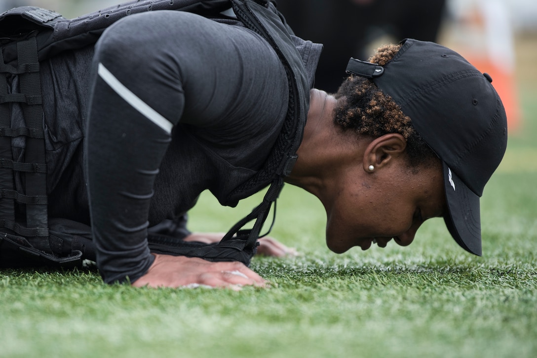 Tech. Sgt. Keisha Waldron, 30th Civil Engineer Squadron Airman dorm leader, performs pushups during the Police Week Warrior Workout of the Day challenge May 16, 2019, at Vandenberg Air Force Base, Calif. The 30th SFS hosted not only the Warrior WOD challenge, but also a pistol competition, Jail and Bail, Ruck to Remember, Police Expo and candlelight vigil throughout Police Week to honor the men and women of law enforcement. (U.S. Air Force photo by Airman 1st Class Hanah Abercrombie)