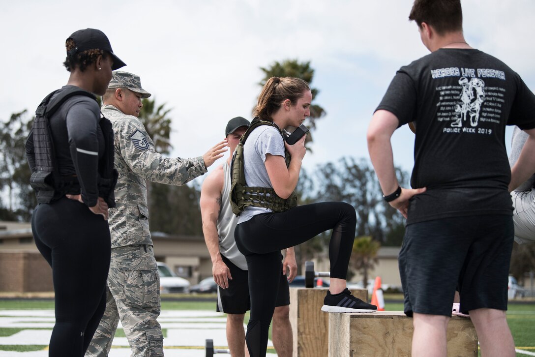 Airman 1st Class Megan Rison, 30th Comptroller Squadron financial manager, performs box step-ups during the Police Week Warrior Workout of the Day Challenge May 16, 2019, at Vandenberg Air Force Base, Calif. In 1962, President John F. Kennedy signed a proclamation that designated May 15 as Peace Officers Memorial Day and the week in which that date falls as Police Week. (U.S. Air Force photo by Airman 1st Class Hanah Abercrombie)