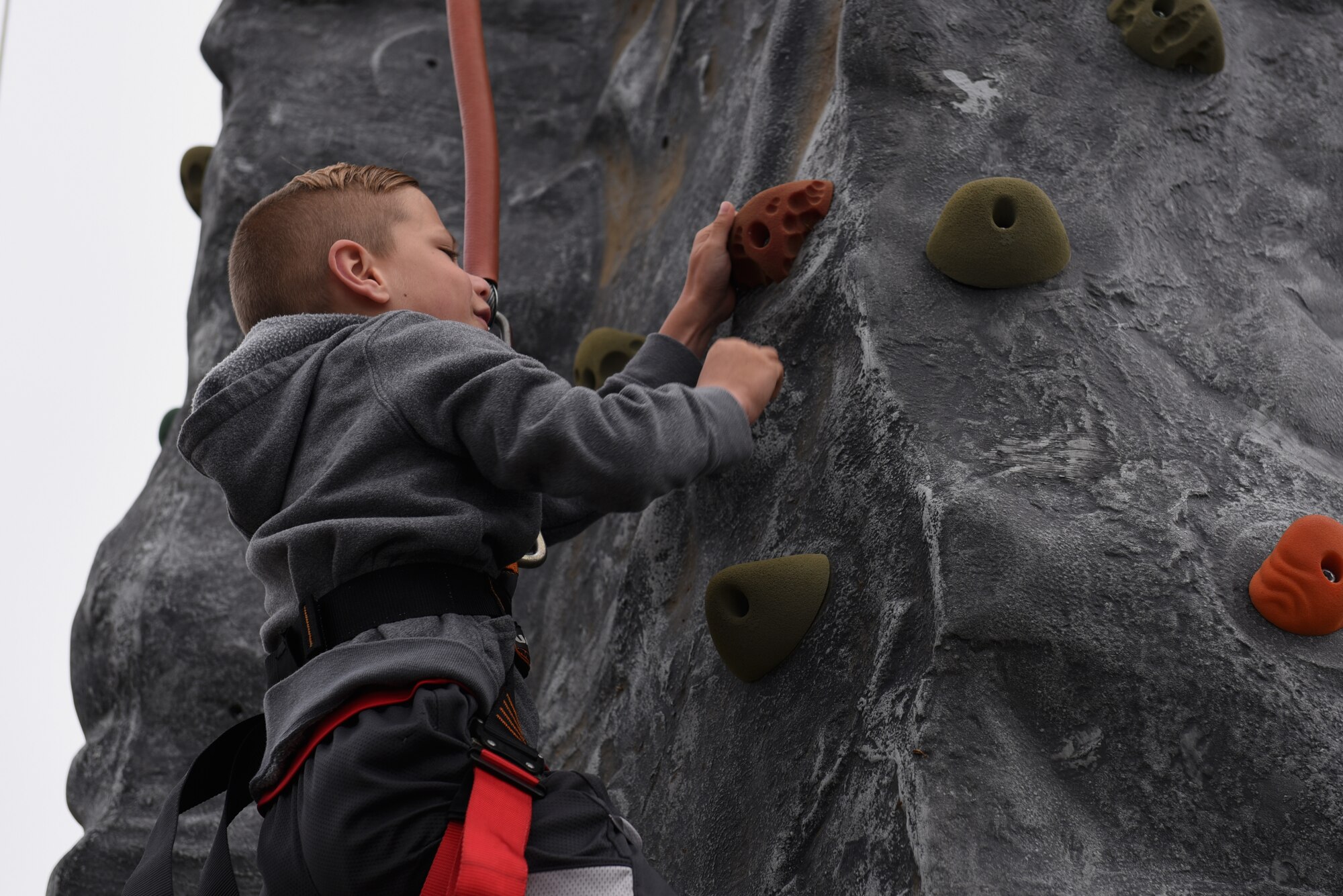 Keaton Evans, California Dreaming Spring Block Party attendee, climbs a rock wall May 18, 2019, at Travis Air Force Base, California. The 60th Air Mobility Wing chaplain’s office hosts quarterly block parties to promote goodwill and camaraderie among Travis Airmen and their families. (U.S. Air Force photo by Airman 1st Class Cameron Otte)