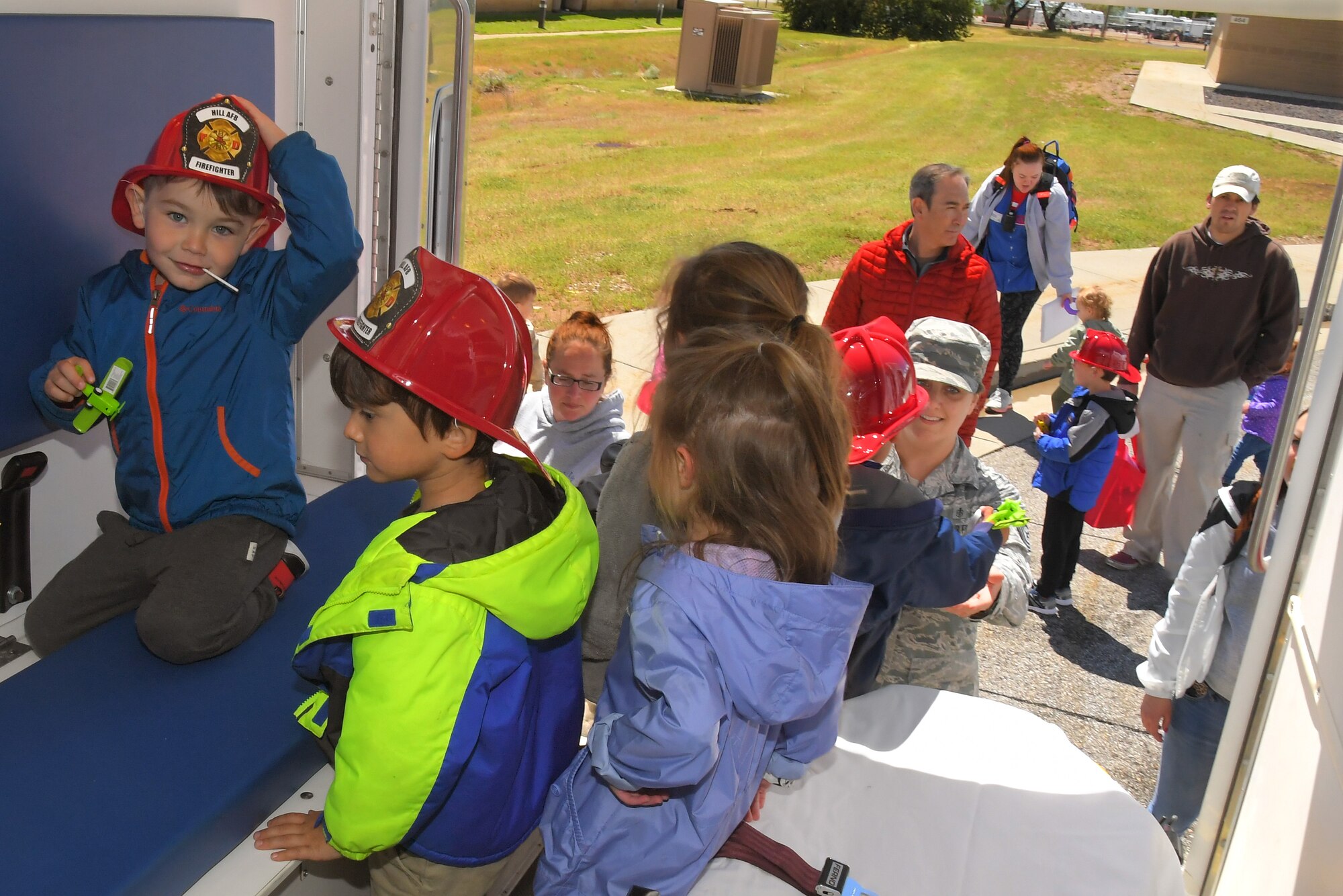 Children get a chance to see the inside of an Ambulance, with the help of Tech Sgt. Jessica Flynn, 75th Medical Group at the Wheels of Wonder event, May 17, 2019, Hill Air Force Base, Utah. (U.S. Air Force photo by Todd Cromar)