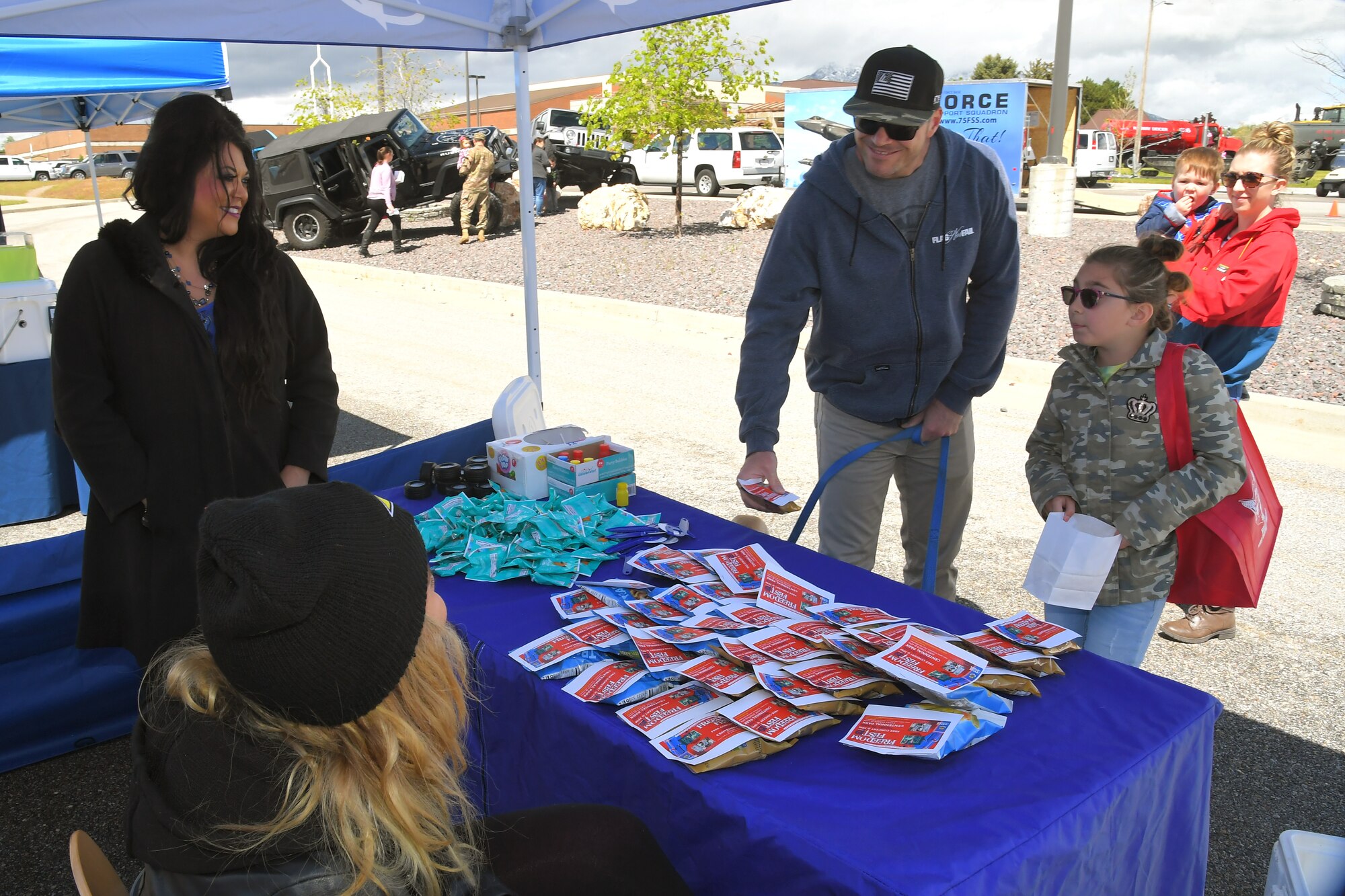 (left to right) Johanne Bercher, and Makelle Kimball, both 75th Force Support Squadron talk with visitors, Rusty and Jovey Eagle at the Wheels of Wonder event, May 17, 2019, Hill Air Force Base, Utah. (U.S. Air Force photo by Todd Cromar)