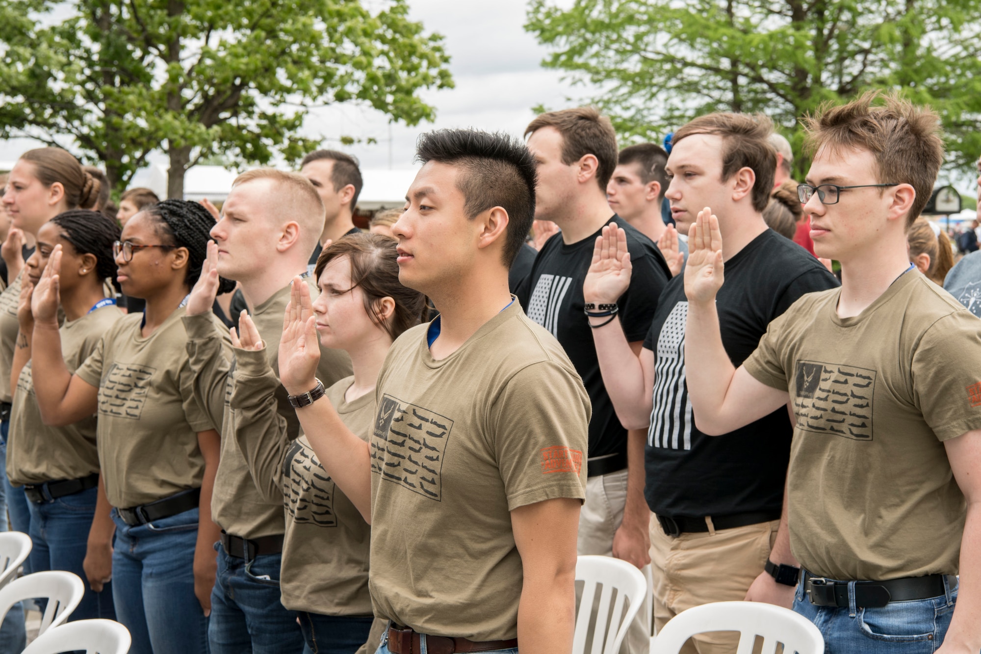 Recruits from the 434th Air Refueling Wing at Grissom Air Reserve Base, Indiana recite the oath of enlistment during a mass enlistment ceremony at the Indianapolis Motor Speedway May 19, 2019. The oath of enlistment is a military oath made by members of the United States armed forces who are not commissioned officers. (U.S. Air Force photo/Master Sgt. Ben Mota)