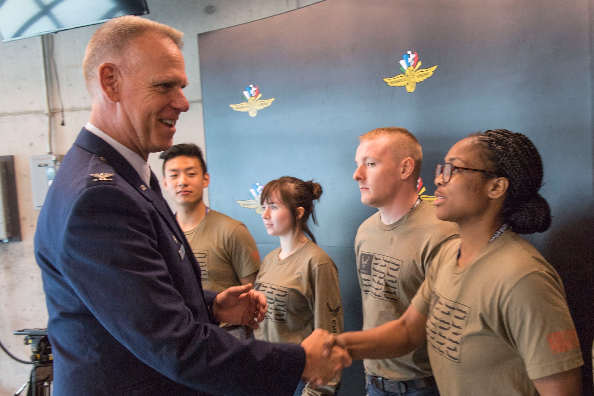Col. Larry Shaw, 434th Air Refueling Wing commander, congratulates newly enlisted trainee Adrienne White, following a mass enlistment ceremony at the Indianapolis Motor Speedway May 19, 2019. Trainees will begin drilling at Grissom Air Reserve base, Indiana in the Developmental Training Flight prior to attending Air Force basic training. (U.S. Air Force photo/Master Sgt. Ben Mota)