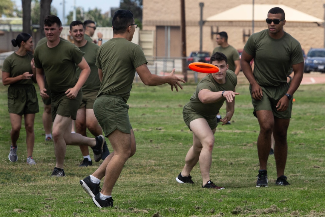 Marines with Headquarters and Headquarters Squadron participate in an ultimate Frisbee game on MCAS Miramar, Calif., May 17. The game was held to bring non-commissioned officers together to build unit cohesion. (U.S. Marine Corps photo by Cpl. Nadia J. Stark/released)